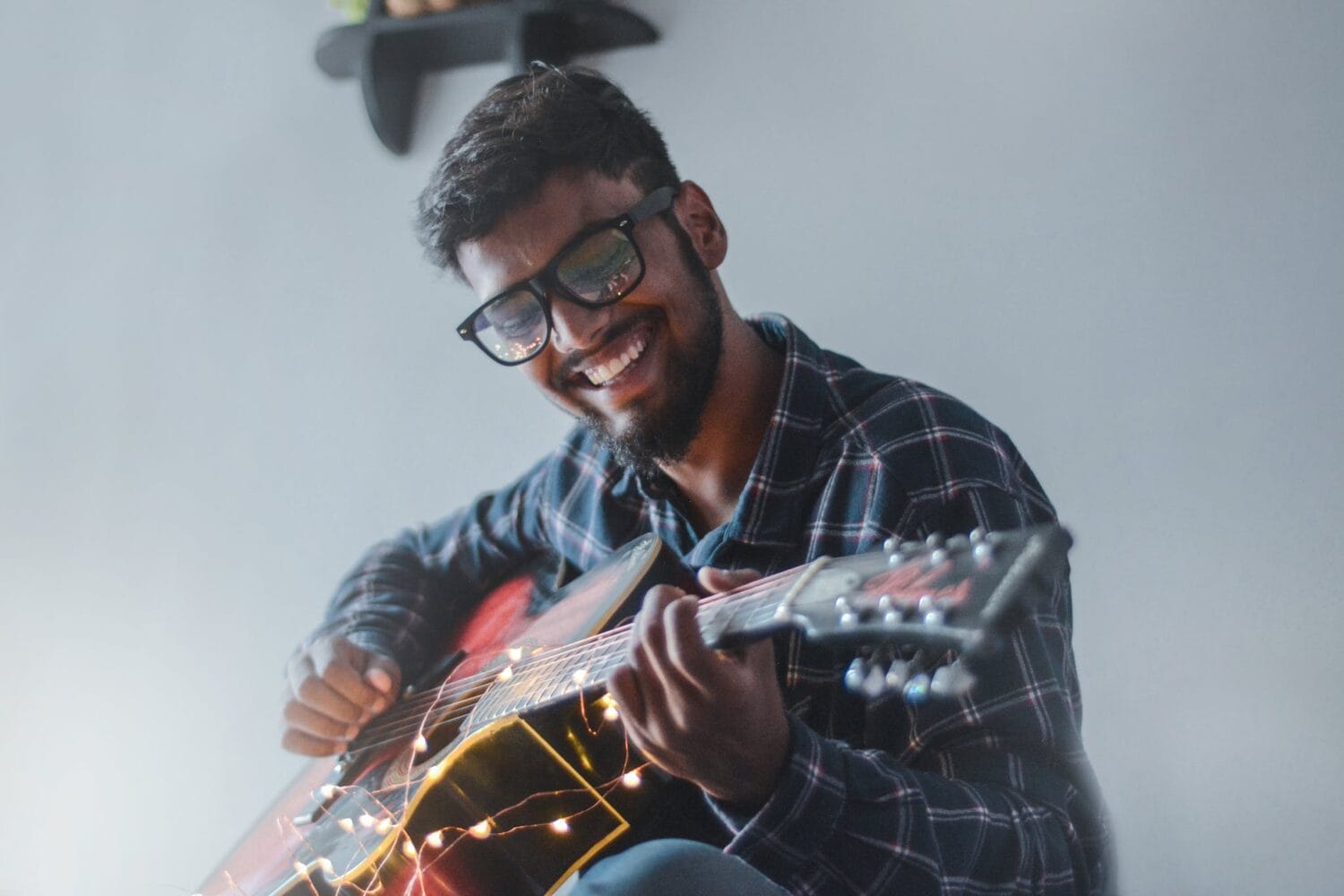 Person Playing Electric Guitar